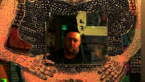 Phillip Duncan surrounded by his artwork